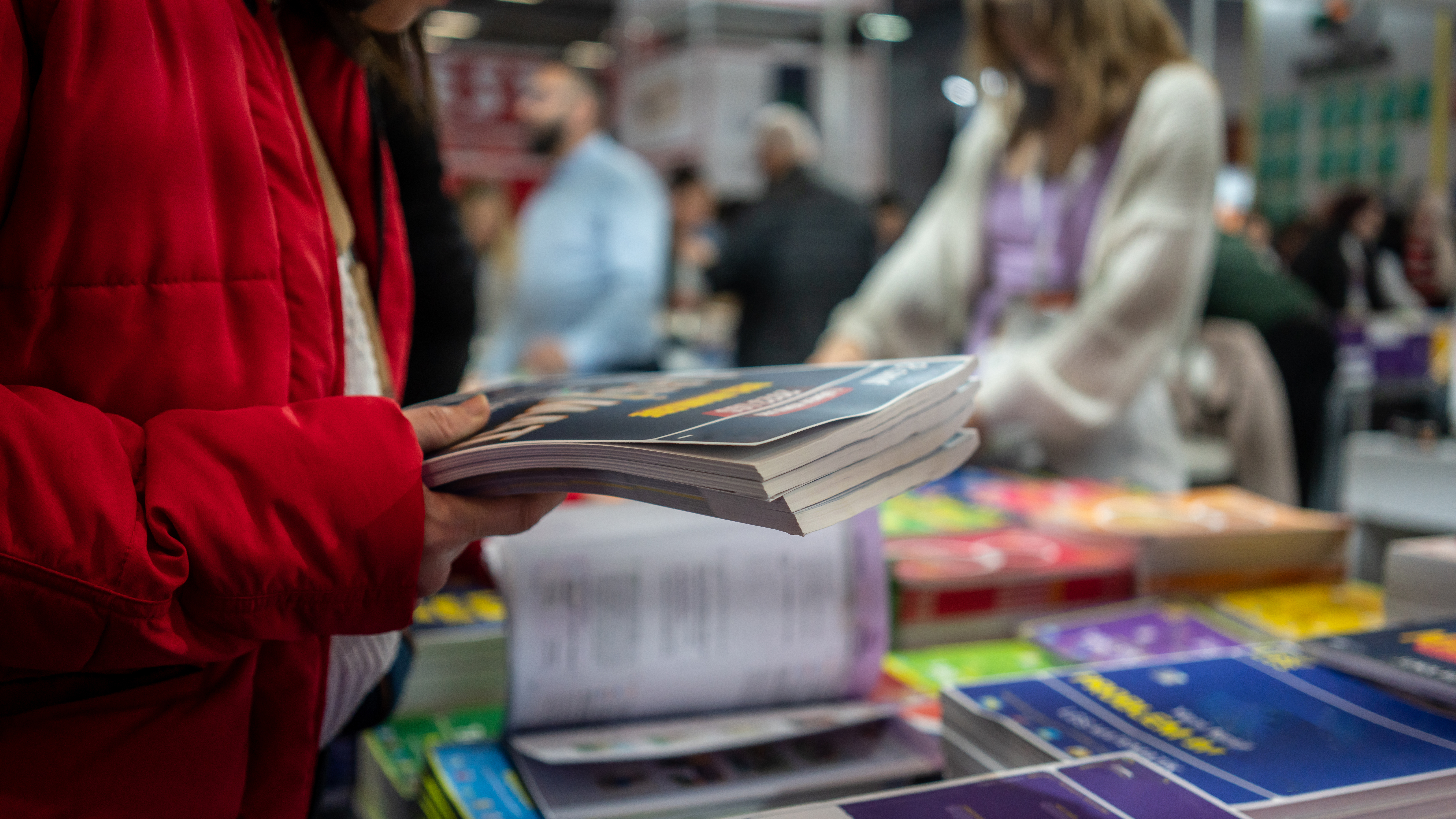 women is buying books book shop horizontal still