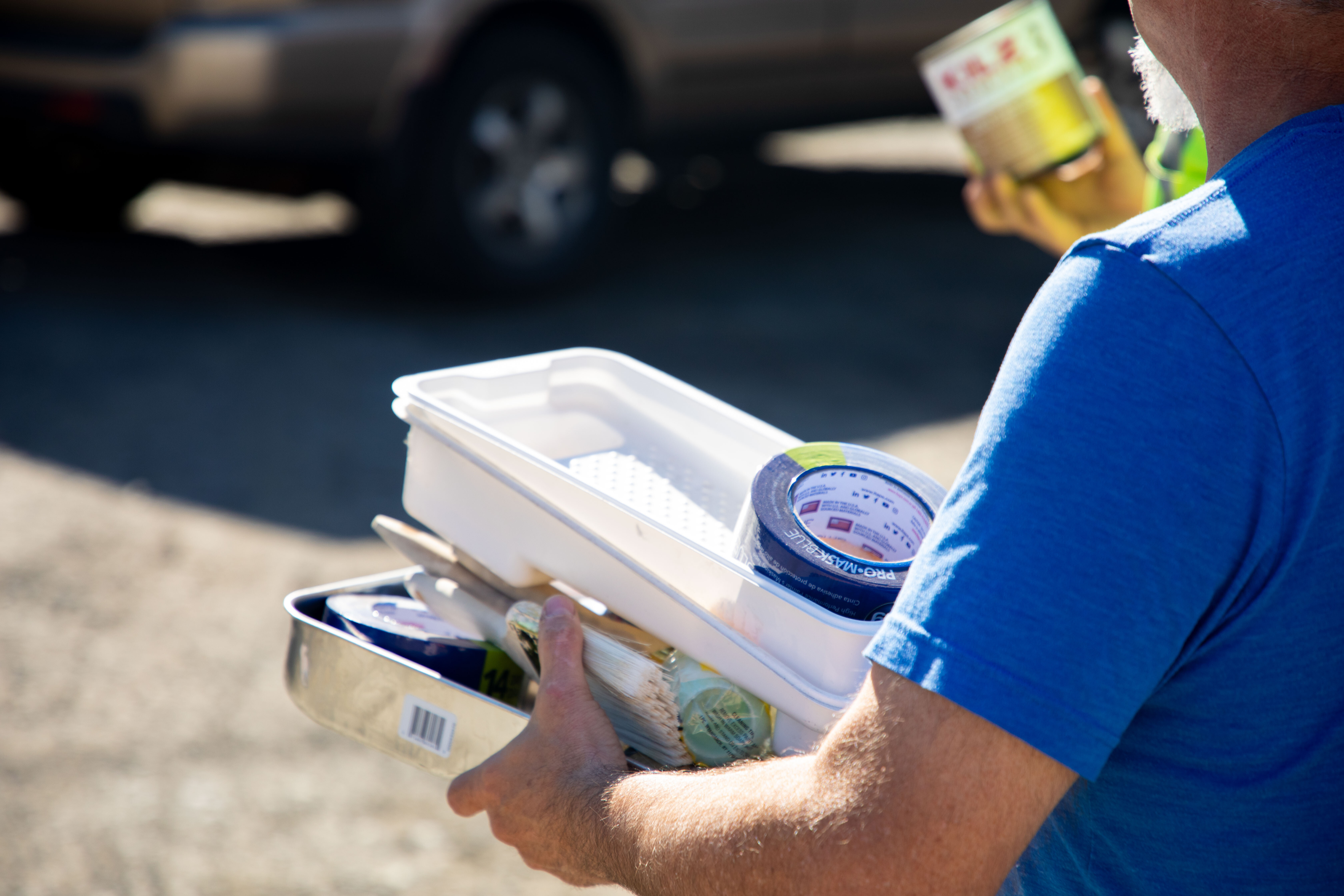 A man holding painting materials