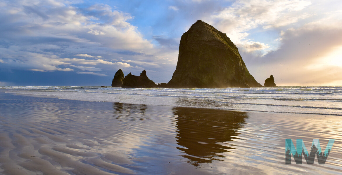 Haystack Rock at sunset after a rainstorm.