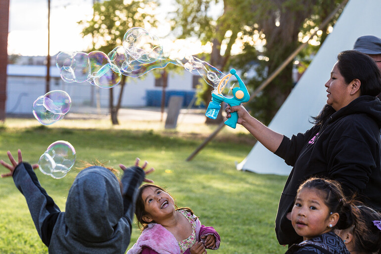 Children playing with bubbles