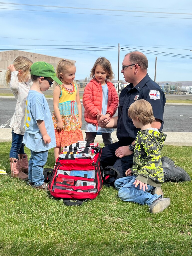 All Nations Center Adventurer Club takes a photo with local EMT