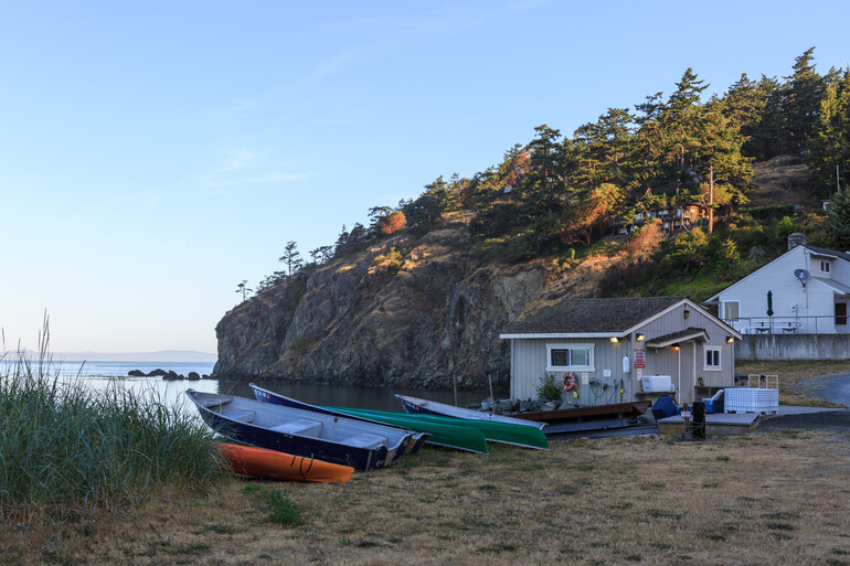 Photo of boats on the shore of Rosario Beach Marine Laboratory.