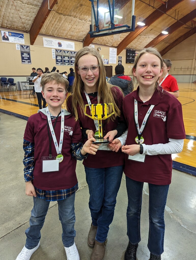 The LGACS team with their Grand Champion trophy.