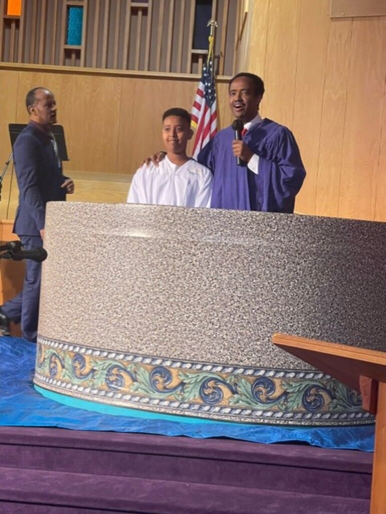 Pastor prepares to celebrate baptism.
