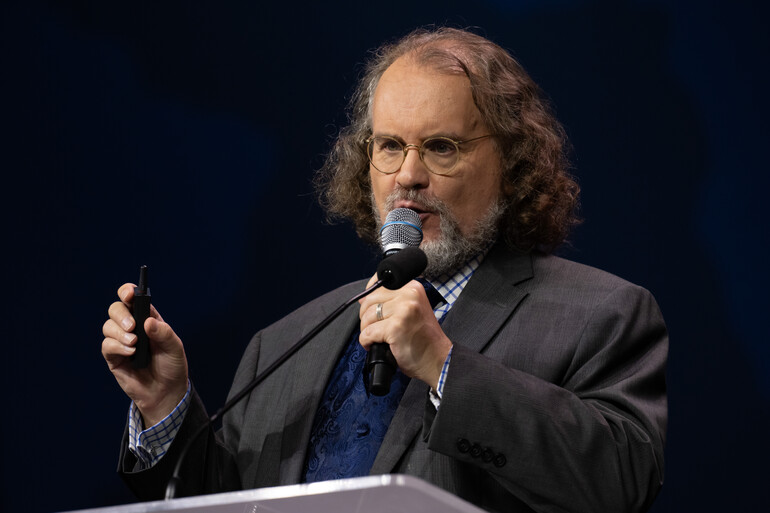 David Trim, Director, and Editor of Encyclopedia of Seventh-day Adventists, Office of Archives, Statistics, and Research (GC) presenting data behind the I Will Go strategic plan at the morning business meeting on Friday, July 11, 2025. The 62nd General Conference Session of the Seventh-day Adventist Church, America’s Center Convention Complex, St. Louis, Missouri, USA, July 3-12, 2025. Camera date: Friday, July 11, 2025 09:48.