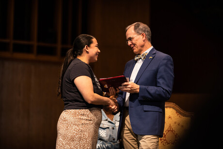 Amanda Ponce receives award. 