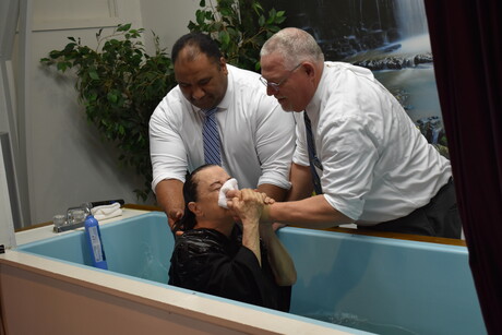 Na'a and Brown baptize Deanna