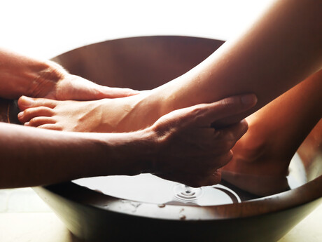 footwashing close up hands on foot
