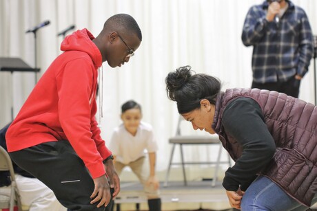 Two attendees concentrating during the games.