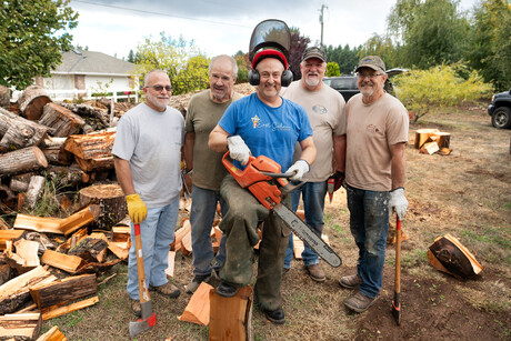 group of men with wood cutting tools
