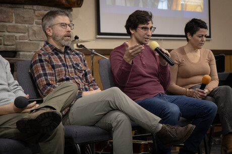 A panel of speakers respond to a question from the audience.