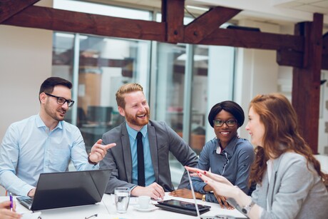 Image of business partners discussing documents and ideas during business meeting.