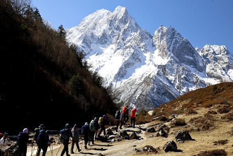 a group hiking through high mountains