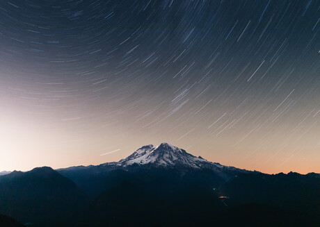 Long-exposure night photograph of Mount Rainier
