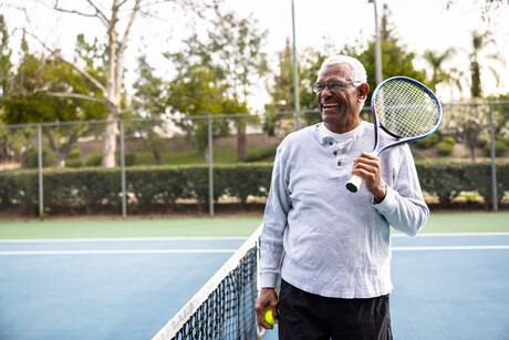 A senior black man smiling