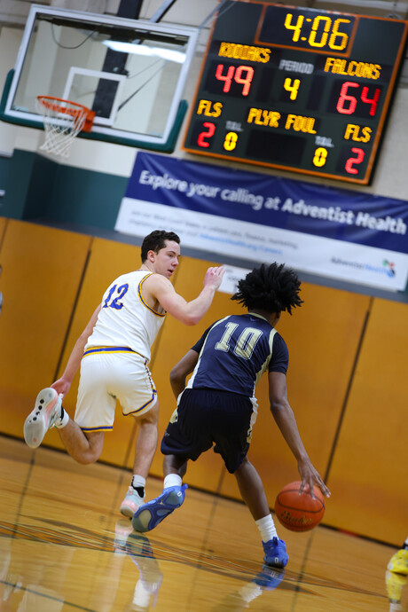 Two basketball players on court