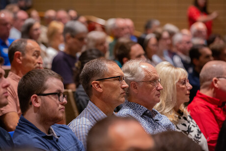Faculty in auditorium seats