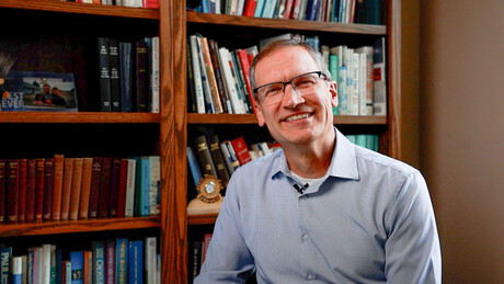 Paul Dybdahl in a library