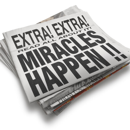 Newspaper with big headline that says, &quot;Miracles Happen.&quot;