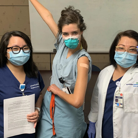 Karen Ong and her mother administer a vaccine.