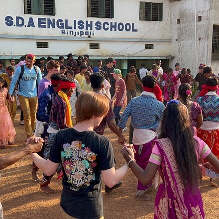 people in front of school in India