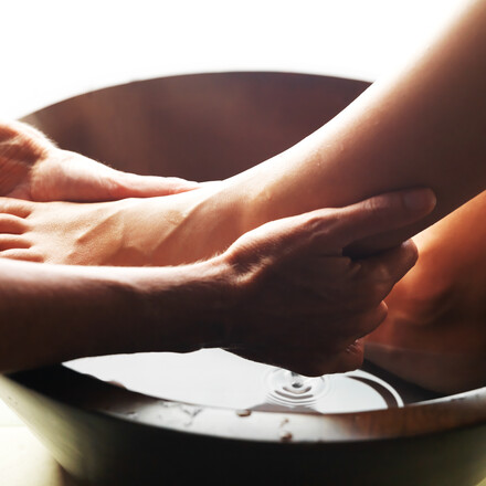 footwashing close up hands on foot