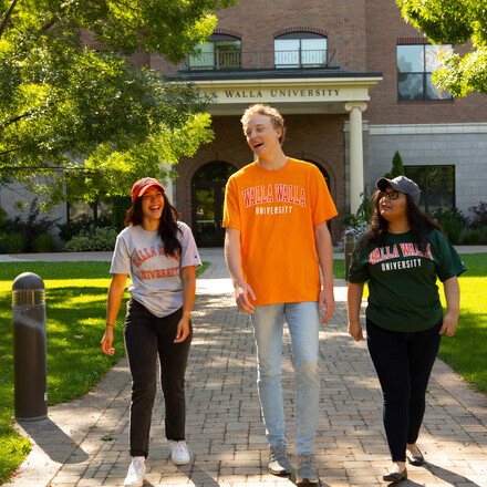 Students walk on campus in WWU gear