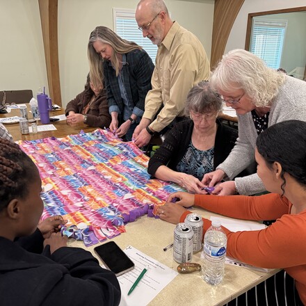 Kathy Marson leads a hands-on example of creating prayer blankets.