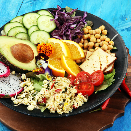 grilled tofu and dragon fruit buddha bowl with vegetable and humus.