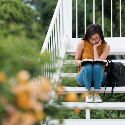 Reading, Young Women,  Concentrated,Campus, Stairs, Student, Millennial, Latin,