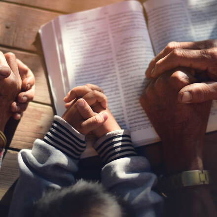The boy prayed on the table. The family prayed together.