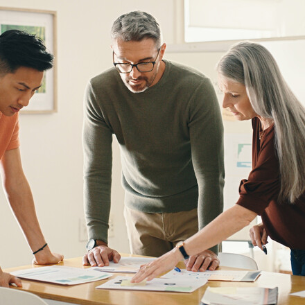 Collaboration, documents or business people in meeting planning a group startup project together. Strategy, brainstorming ideas or workers with data analytics paperwork for our vision or sales goals