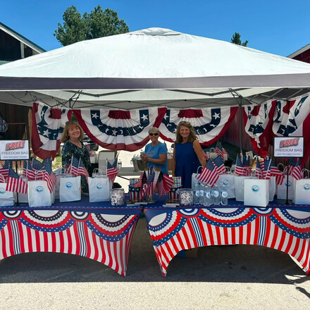 From left to right: Chery Casey, Garden Valley Church secretary; Marge Van Dyk, Garden Valley Church head deaconess; and Peggy Lucht Garden Valley Church personal ministries leader, man the church’s booth in Crouch, Idaho, on the Fourth of July.