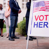 Diverse People At Voting Booth. Vote Here Elections Sign