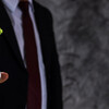 businessman holding jar of coin with small tree growing up