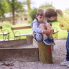 Girl Supporting Sad Boy Sitting Alone on Playground