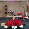 Set pieces and flowers adorn the stage of the Kennewick Seventh-day Adventist Church