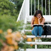 Reading, Young Women,  Concentrated,Campus, Stairs, Student, Millennial, Latin,