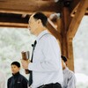 Pastor Steve Rogers speaks outdoors with a bible in his hands