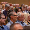 Faculty in auditorium seats