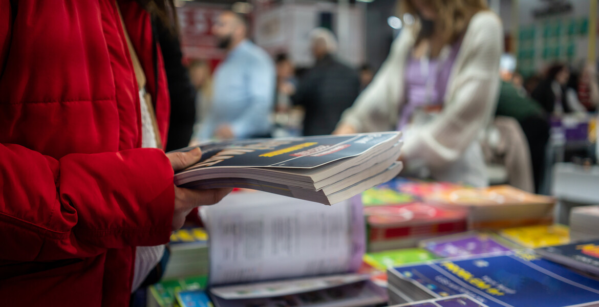 women is buying books book shop horizontal still