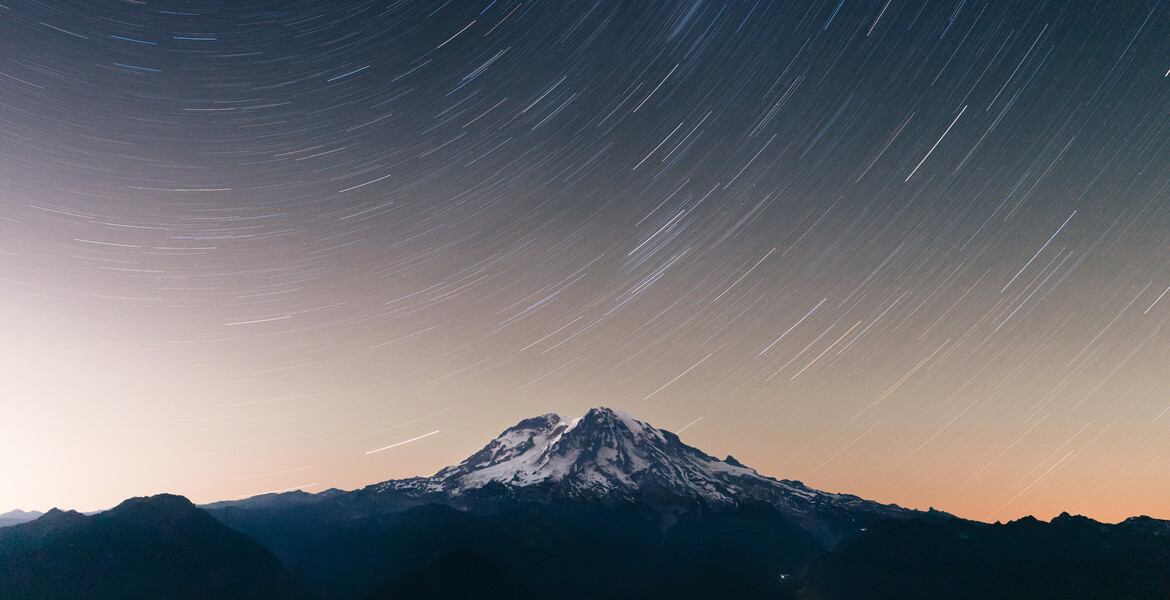 Long-exposure night photograph of Mount Rainier