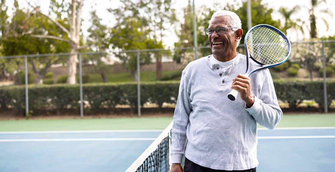 A senior black man smiling