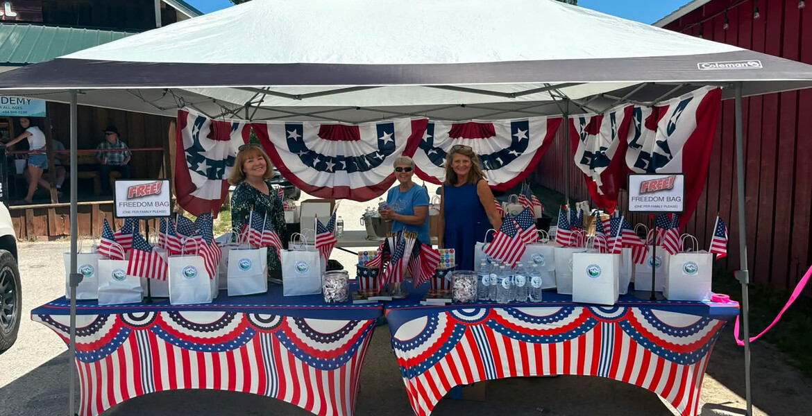 From left to right: Chery Casey, Garden Valley Church secretary; Marge Van Dyk, Garden Valley Church head deaconess; and Peggy Lucht Garden Valley Church personal ministries leader, man the church’s booth in Crouch, Idaho, on the Fourth of July.