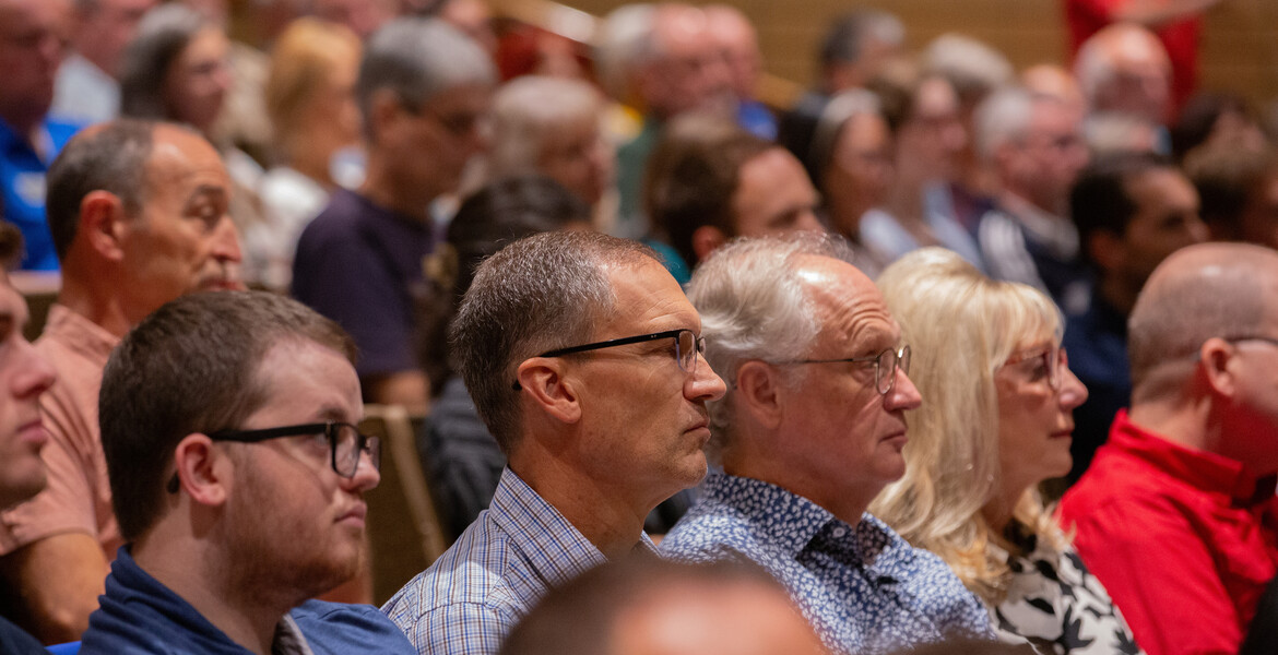 Faculty in auditorium seats
